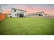 Spacious backyard with well-maintained lawn and screened porch, perfect for entertaining or relaxing at 141 Pine Crest View Dr, Summerville, SC 29486