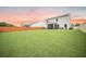 Lush, green backyard with a charming white home and privacy fence at 141 Pine Crest View Dr, Summerville, SC 29486