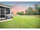 Expansive backyard featuring lush green lawn and privacy fence, ideal for outdoor activities at 141 Pine Crest View Dr, Summerville, SC 29486