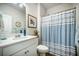 Nautical themed bathroom features a single sink vanity and a striped shower curtain at 141 Pine Crest View Dr, Summerville, SC 29486