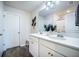 Bathroom featuring double sinks, white cabinets, a large mirror, and modern fixtures with wood look floors at 141 Pine Crest View Dr, Summerville, SC 29486