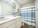 Modern bathroom featuring a double sink vanity and a striped shower curtain at 141 Pine Crest View Dr, Summerville, SC 29486