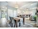 Open concept dining area featuring wood table with seating for four and seamless access to the living room at 141 Pine Crest View Dr, Summerville, SC 29486