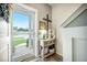 Inviting entryway with a decorative table, a lamp, and a view of the front yard at 141 Pine Crest View Dr, Summerville, SC 29486
