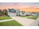 Two-story home featuring blue and gray siding, a spacious driveway, and a well-manicured lawn at 141 Pine Crest View Dr, Summerville, SC 29486