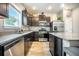 Kitchen featuring granite countertops, stainless steel appliances, dark wood cabinetry, and wood-look flooring at 141 Pine Crest View Dr, Summerville, SC 29486