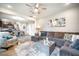 Open-concept living room with a large sectional sofa and seamless flow into the dining area at 141 Pine Crest View Dr, Summerville, SC 29486