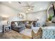 Spacious living room with a large sectional sofa, a ceiling fan, and neutral decor at 141 Pine Crest View Dr, Summerville, SC 29486