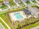 A community pool with poolside furniture, landscaping, and a cabana for relaxing outdoors at 141 Pine Crest View Dr, Summerville, SC 29486