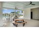 Covered poolside picnic area with picnic tables and ceiling fans overlooking the pool and community at 141 Pine Crest View Dr, Summerville, SC 29486