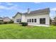 Back exterior features a well maintained lawn, a patio and many windows at 1445 Ashley Gardens Blvd, Charleston, SC 29414