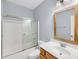 Bathroom featuring vanity with wooden cabinet, shower with glass doors, and modern fixtures at 1445 Ashley Gardens Blvd, Charleston, SC 29414