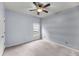 Cozy bedroom with a ceiling fan, horizontal stripes, and a window for natural light at 1445 Ashley Gardens Blvd, Charleston, SC 29414