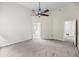 Spacious bedroom featuring neutral walls, carpet flooring, ceiling fan, and access to an ensuite bathroom at 1445 Ashley Gardens Blvd, Charleston, SC 29414