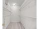 Walk-in closet with white wire shelving and neutral carpeting at 1445 Ashley Gardens Blvd, Charleston, SC 29414