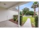 Charming front porch view with meticulously landscaped yard and sidewalk at 1445 Ashley Gardens Blvd, Charleston, SC 29414