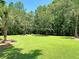 Expansive green space perfect for outdoor activities, featuring mature trees and a picnic table at 1445 Ashley Gardens Blvd, Charleston, SC 29414