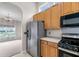 Bright kitchen featuring stainless steel appliances, plenty of cabinet space, and easy access to living area at 1445 Ashley Gardens Blvd, Charleston, SC 29414