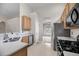 Kitchen featuring stainless steel appliances, granite countertops, tile flooring, and a view to another room at 1445 Ashley Gardens Blvd, Charleston, SC 29414