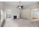 Spacious living room featuring vaulted ceilings, fireplace, built-in shelving, and neutral color palette at 1445 Ashley Gardens Blvd, Charleston, SC 29414