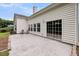 Back patio with a home exterior with multiple windows and sliding glass door at 1445 Ashley Gardens Blvd, Charleston, SC 29414