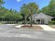 Community pool house featuring an open entrance, manicured landscaping and ample parking at 1445 Ashley Gardens Blvd, Charleston, SC 29414