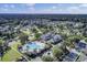 An aerial view showcasing a community's pool and clubhouse surrounded by mature trees and green spaces at 1489 Red Tide Rd, Mount Pleasant, SC 29466