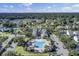 Community clubhouse and pool with manicured lawns, mature trees, and ample parking at 1489 Red Tide Rd, Mount Pleasant, SC 29466