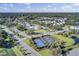 Aerial view of a community featuring tennis courts, swimming pool, and surrounding residences at 1489 Red Tide Rd, Mount Pleasant, SC 29466