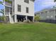 Backyard showing patio area beneath home with ample outdoor space and manicured lawn at 1489 Red Tide Rd, Mount Pleasant, SC 29466
