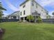 Large backyard with green grass, privacy fence, lush landscaping, and ample space for outdoor activities at 1489 Red Tide Rd, Mount Pleasant, SC 29466