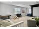 Bright basement with a play area, game table, seating, and basketball hoop for recreation at 1489 Red Tide Rd, Mount Pleasant, SC 29466