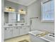 Bathroom showcasing a soaking tub, double vanity, and modern fixtures at 1489 Red Tide Rd, Mount Pleasant, SC 29466