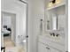 Well-lit bathroom featuring a white vanity, sleek fixtures, and a decorative mirror at 1489 Red Tide Rd, Mount Pleasant, SC 29466