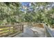 Wooden boardwalk surrounded by lush trees and foliage offering tranquil scenery at 1489 Red Tide Rd, Mount Pleasant, SC 29466