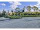A landscaped community area featuring a covered picnic area, lush trees, and attractive landscaping at 1489 Red Tide Rd, Mount Pleasant, SC 29466
