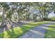 Lush community green space, adorned with mature trees, inviting pathways, and picturesque landscaping at 1489 Red Tide Rd, Mount Pleasant, SC 29466