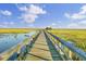 Beautiful community dock surrounded by marshland offers peaceful views and relaxation for residents at 1489 Red Tide Rd, Mount Pleasant, SC 29466