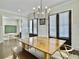 Spacious dining room with ample seating, featuring a chalkboard wall and hardwood floors at 1489 Red Tide Rd, Mount Pleasant, SC 29466
