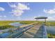 Beautiful community wooden dock providing access to calm marsh waters and scenic vistas at 1489 Red Tide Rd, Mount Pleasant, SC 29466