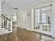 Bright entryway featuring hardwood floors, elegant trim, and a staircase at 1489 Red Tide Rd, Mount Pleasant, SC 29466