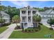 Charming two-story home with double front porches, landscaped yard, and palm trees at 1489 Red Tide Rd, Mount Pleasant, SC 29466