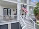 Welcoming porch with seating area and double door entryway, perfect for relaxing outdoors at 1489 Red Tide Rd, Mount Pleasant, SC 29466