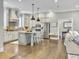 Spacious kitchen featuring stainless steel appliances, island with seating, and stylish pendant lighting at 1489 Red Tide Rd, Mount Pleasant, SC 29466