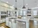 Open concept kitchen features stainless steel appliances and eat-in granite island at 1489 Red Tide Rd, Mount Pleasant, SC 29466