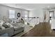 Open concept living room with a gray sofa, play area, and stylish decor at 1489 Red Tide Rd, Mount Pleasant, SC 29466