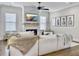 Comfortable living room with fireplace, TV, shiplap accent wall, and natural light at 1489 Red Tide Rd, Mount Pleasant, SC 29466