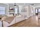 Spacious living room features a shiplap accent wall, fireplace, and hardwood floors at 1489 Red Tide Rd, Mount Pleasant, SC 29466