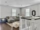 Inviting living room boasts wood floors, a grey sectional sofa, and decorative accents at 1489 Red Tide Rd, Mount Pleasant, SC 29466