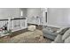 Open living room with a gray sofa and play area for the  at 1489 Red Tide Rd, Mount Pleasant, SC 29466